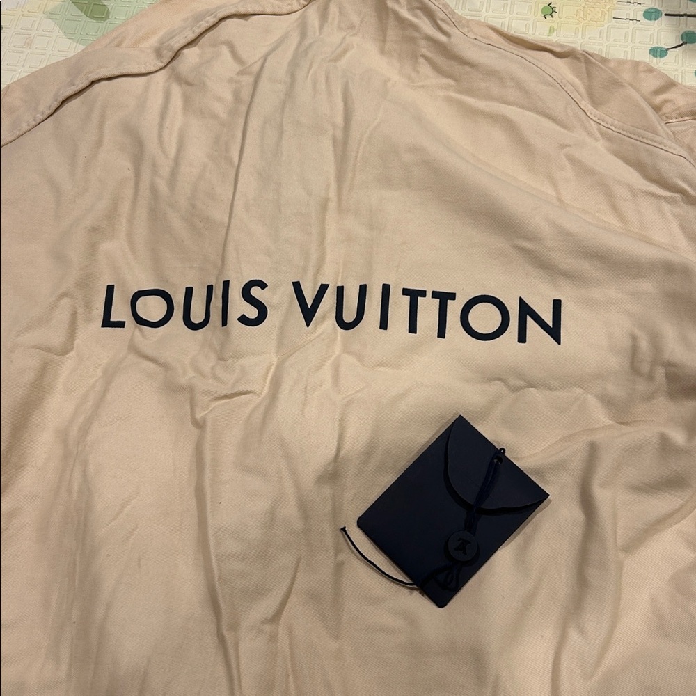 Authentic Louis Vuitton crème cotton garment bag